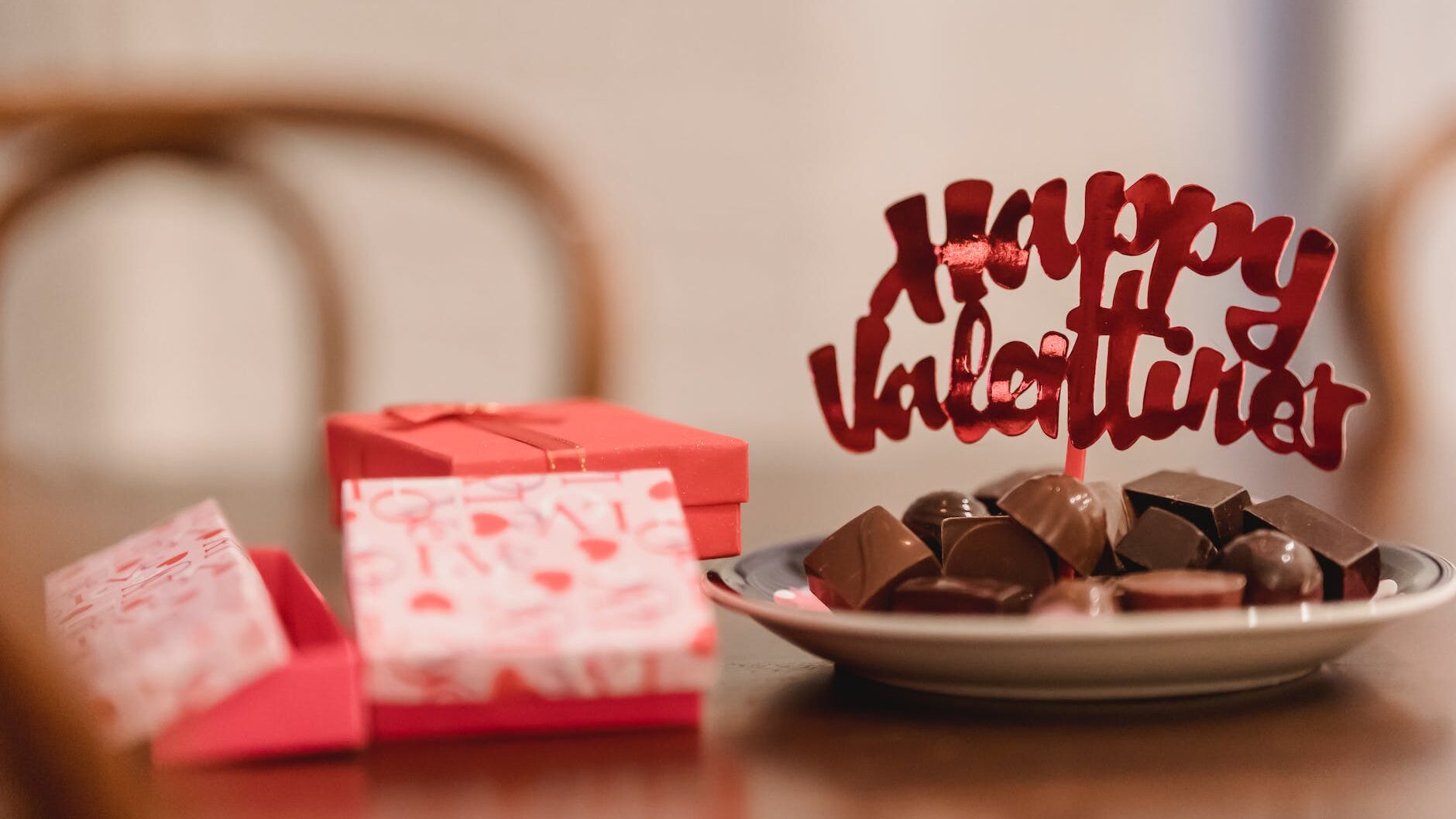 small gift boxes with chocolates on table