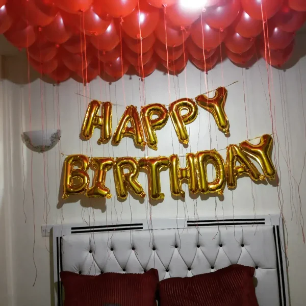 Happy Birthday Foil Banner hanging in a festive birthday party setting in Kenya
