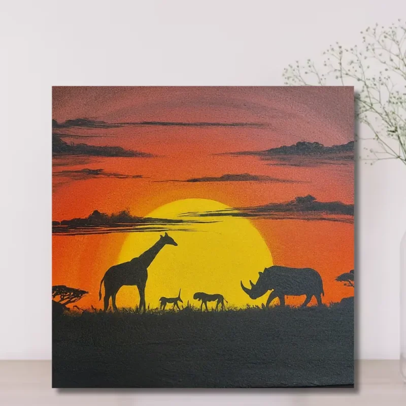 Wildlife sunset canvas print with giraffes and rhino against an orange sunset in Kenya